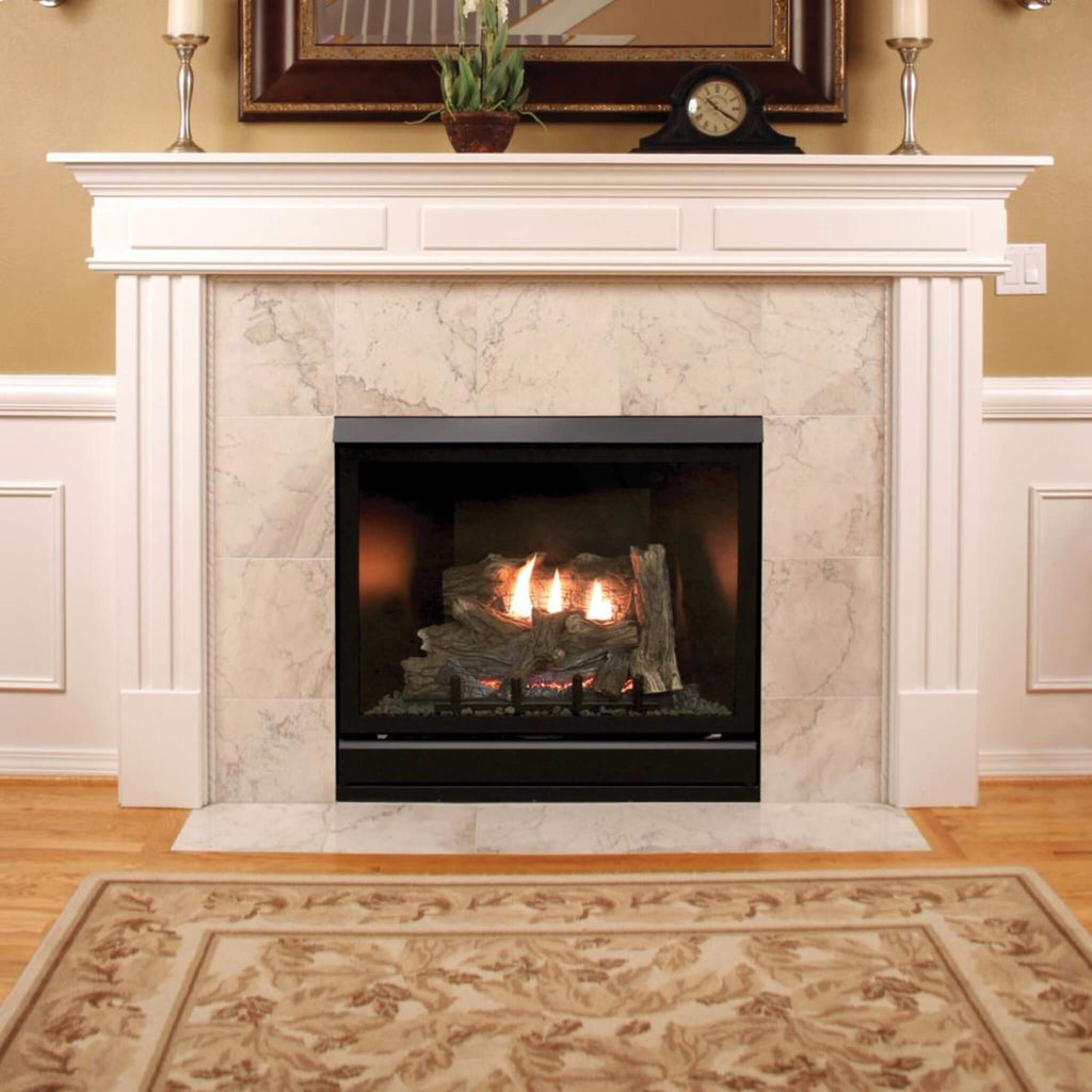 A Tahoe Clean-face Deluxe 32" Fireplace With Visible Flames And A Hand-painted Ceramic Fiber Log Set, Housed Within A White Mantel, Set Against A Room With Wooden Flooring And A Patterned Rug.