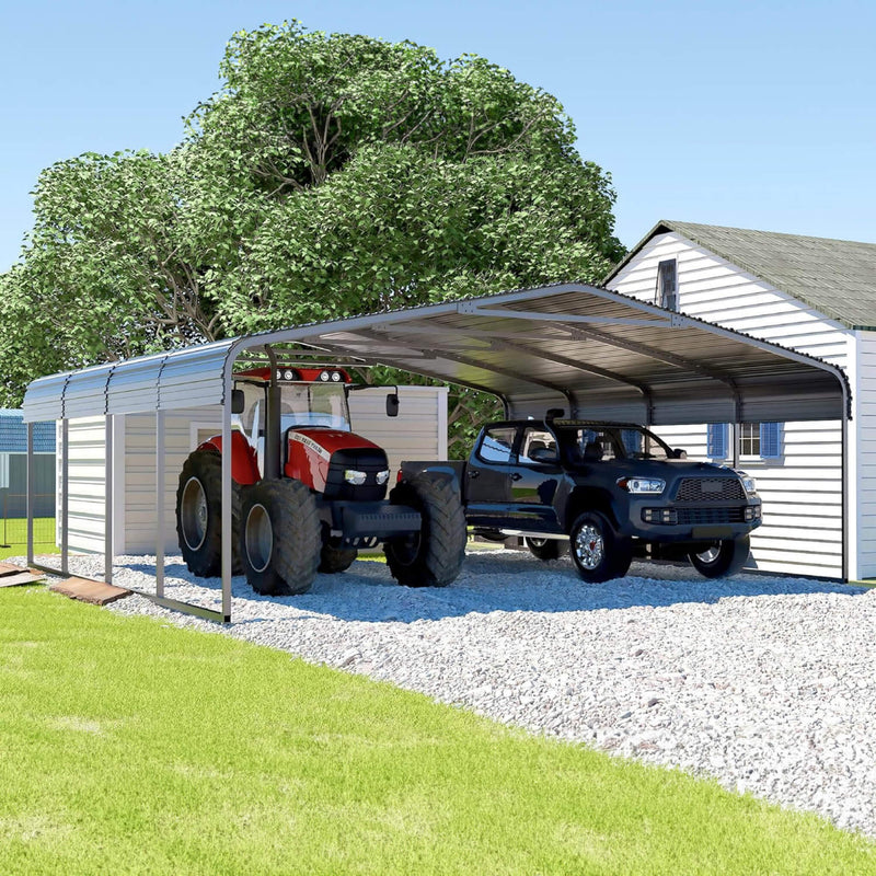 A Large Metal Carport Kit Providing Shelter For Two Vehicles, With A Black Galvanized Steel Roof And A 2X2 Steel Tube Frame, Displayed On A Gravel Surface Next To A Residential Building. - Saksby Wholesale