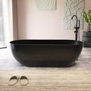 [69X30-Inch] Freestanding Oval Stone Resin Soaking Tub With Overflow Drain (SAK35786) - Saksby Wholesale - Lifestyle Matte Black In Bathroom Front View