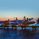 Aqua Marina Glow 10FT All-Around ISUP With Ambient Light System And Safety Leash [BT-24GL] (SAK48269) - Saksby Wholesale - Lifestyle With Four People On Shore Night View