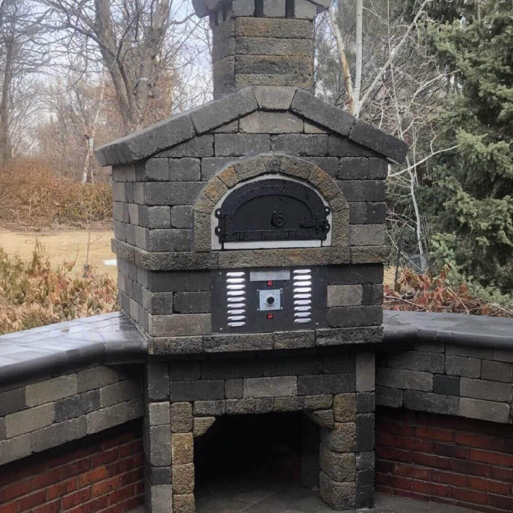 Chicago Brick Oven CBO-750 Commercial Hybrid Wood & Gas Fired Oven DIY Kit [CBO-O-KIT-750-HYB] (SAK75154) - Saksby Wholesale - Lifestyle Image Outside With Dark Bricks