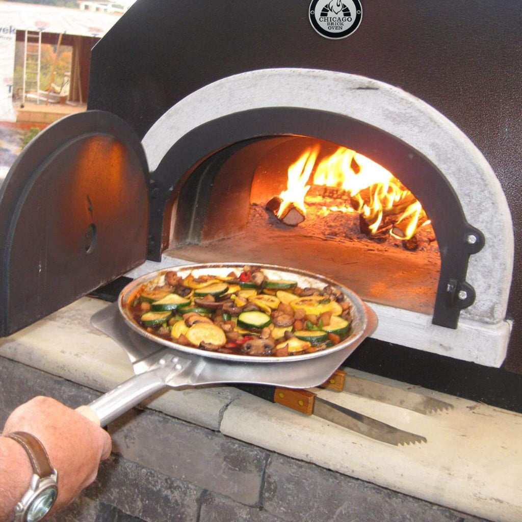Chicago Brick Oven CBO-750 Countertop Wood Fired Pizza Oven With (38x28)" Cooking Surface [CBO-O-CT-750] (SAK42753) - Saksby Wholesale - Cooking Demonstration View 