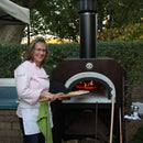 Chicago Brick Oven CBO-750 Countertop Wood Fired Pizza Oven With (38x28)" Cooking Surface [CBO-O-CT-750] (SAK42753) - Saksby Wholesale - Woman Cooking Lifestyle Image