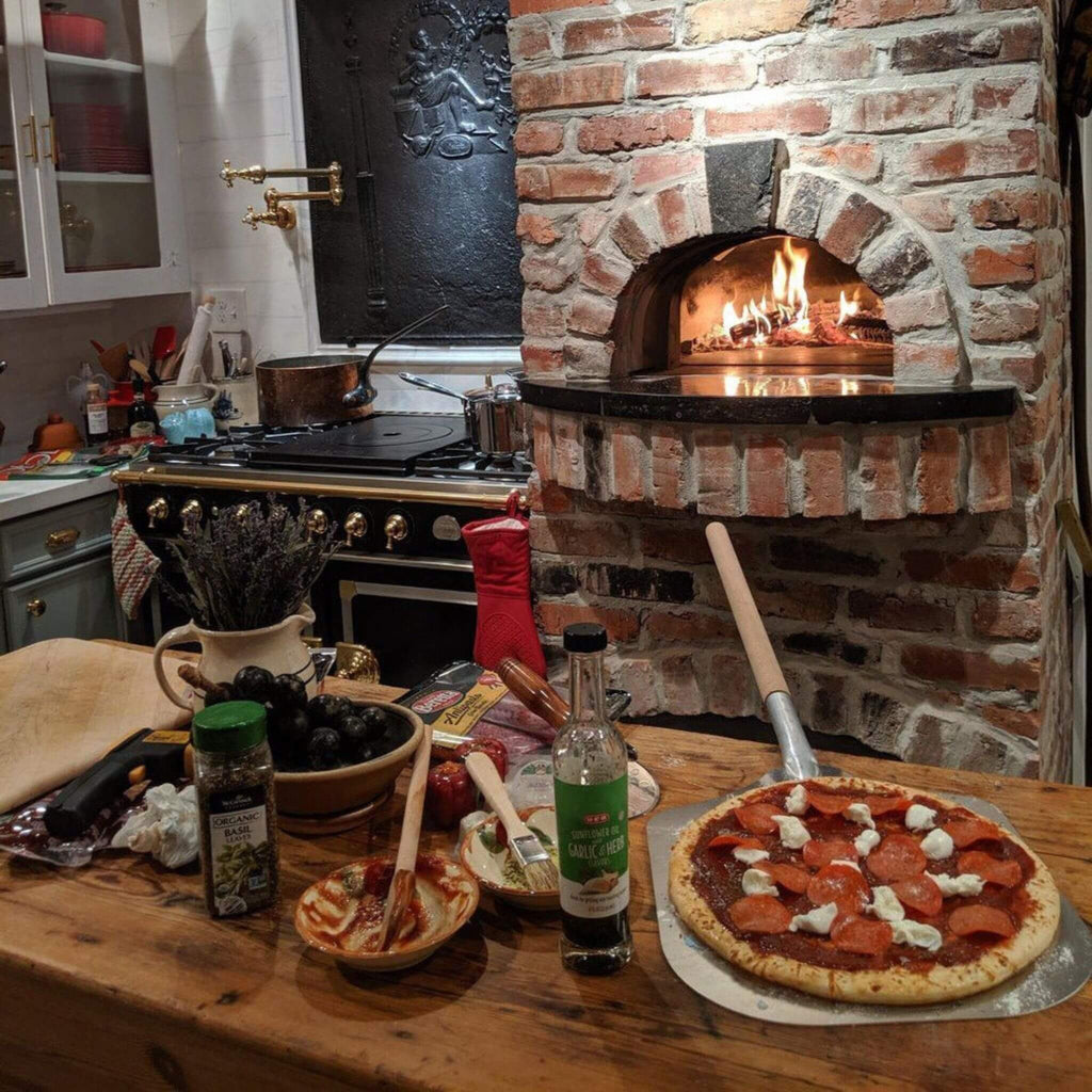 Chicago Brick Oven CBO-750 Wood Fired Pizza Oven DIY Kit With 38" x 28" Cooking Surface [CBO-O-KIT-750] (SAK51793) - Saksby Wholesale - Cooking Surface and Dinner View