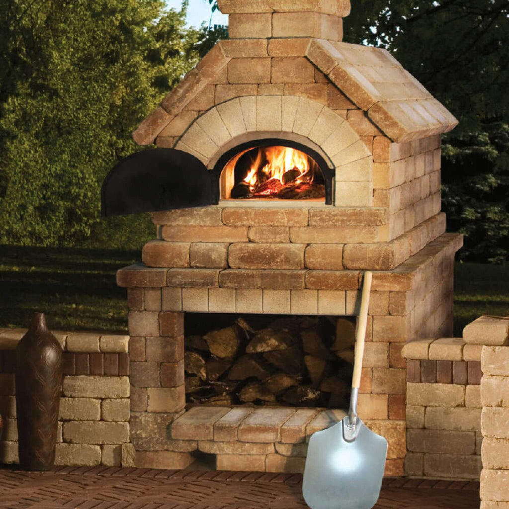 Chicago Brick Oven CBO-750 Wood Fired Pizza Oven DIY Kit With 38" x 28" Cooking Surface [CBO-O-KIT-750] (SAK51793) - Saksby Wholesale - Lifestyle Image Outside With Brown Bricks