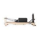 Elina Pilates Lignum Wooden Reformer With Adjustable Height Rope Pulleys [USA 100500] (SAK96321) - Saksby Wholesale - Side View With Luggage On Top
