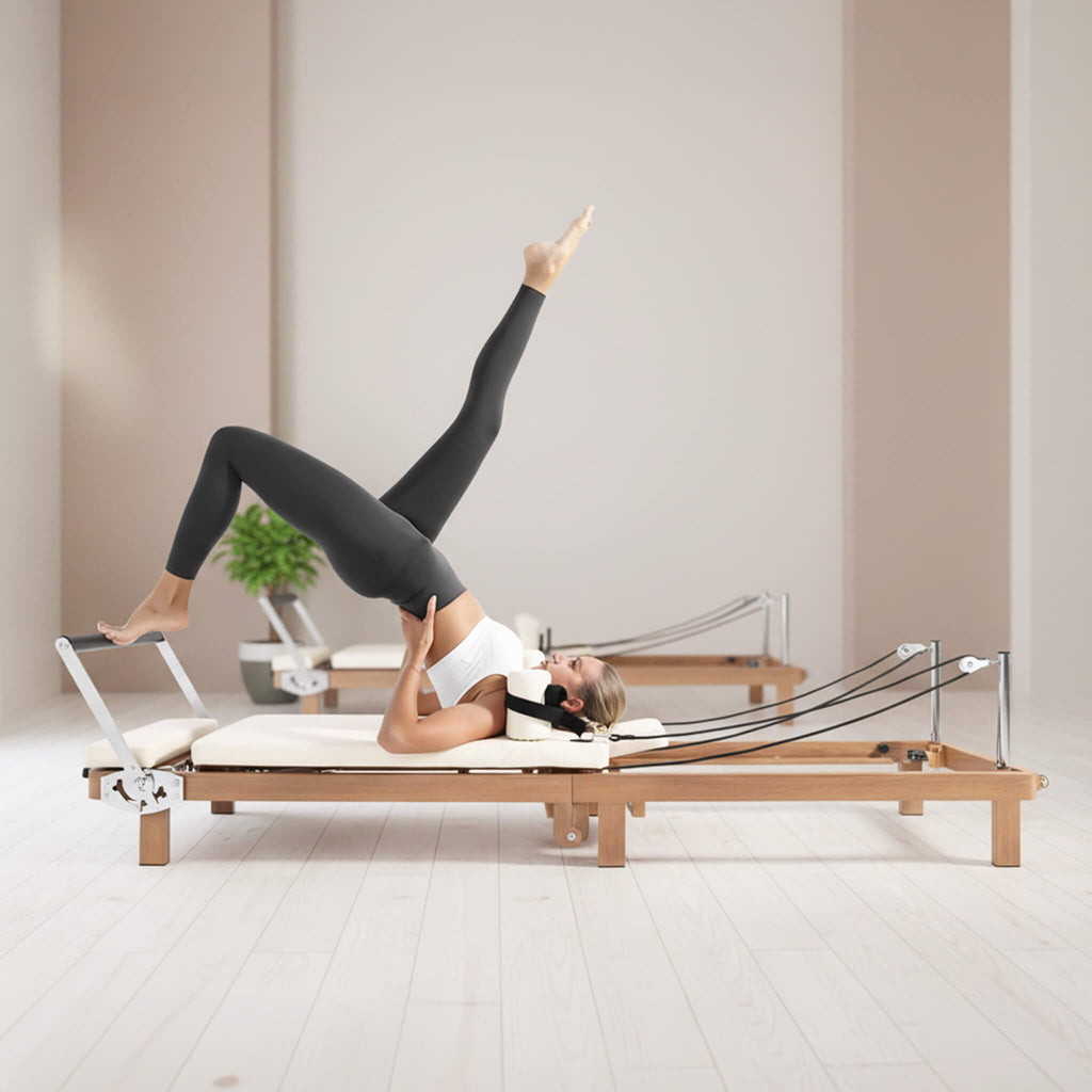Foldable Dual Resistance Pilates Reformer With Jumpboard (SAK83914) - Saksby Wholesale - Lifestyle White Side Left View In Studio