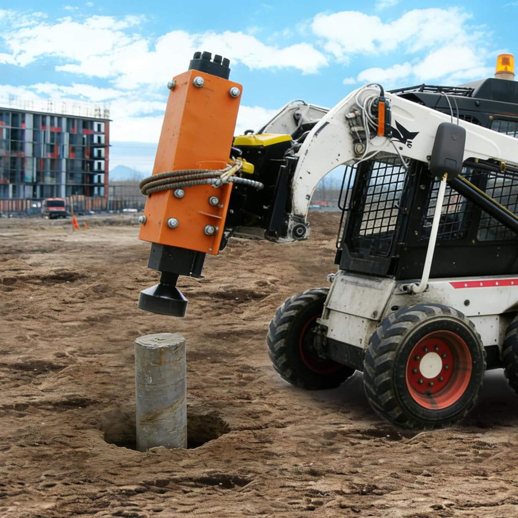 Heavy-Duty 750 FT-LB Hydraulic Skid Steer Pile Hammer Attachment (SAK59134) - Saksby Wholesale - Lifestyle On Loader On Contruction Site