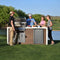 Kokomo Grills Professional Shiplap Outdoor Kitchen Island With Waterfall Edge Built In Grill And Refrigerator SAK65125 Lifestyle Front View On Grass With People