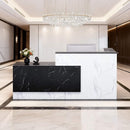L-Shaped Modern Black And White Reception Desk With Lockable Drawers (SAK50729) - Saksby Wholesale - Lifestyle Image In Lobby Setting
