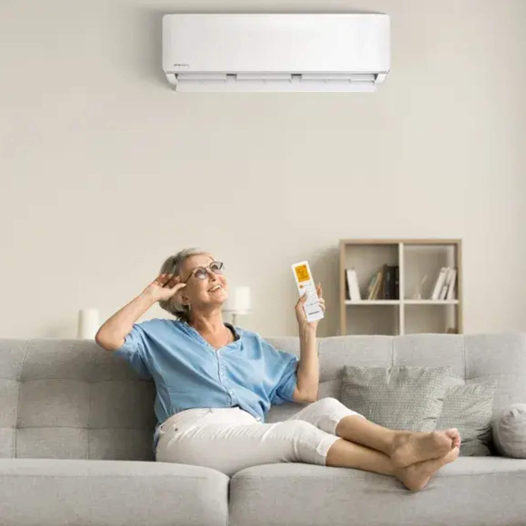 MrCool DIY Easy Pro Lifestyle With Women Sitting On Sofa