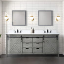 Bathroom Vanity With Two Mirrors, Lights, And A Plant On A Tiled Wall - Saksby Wholesale