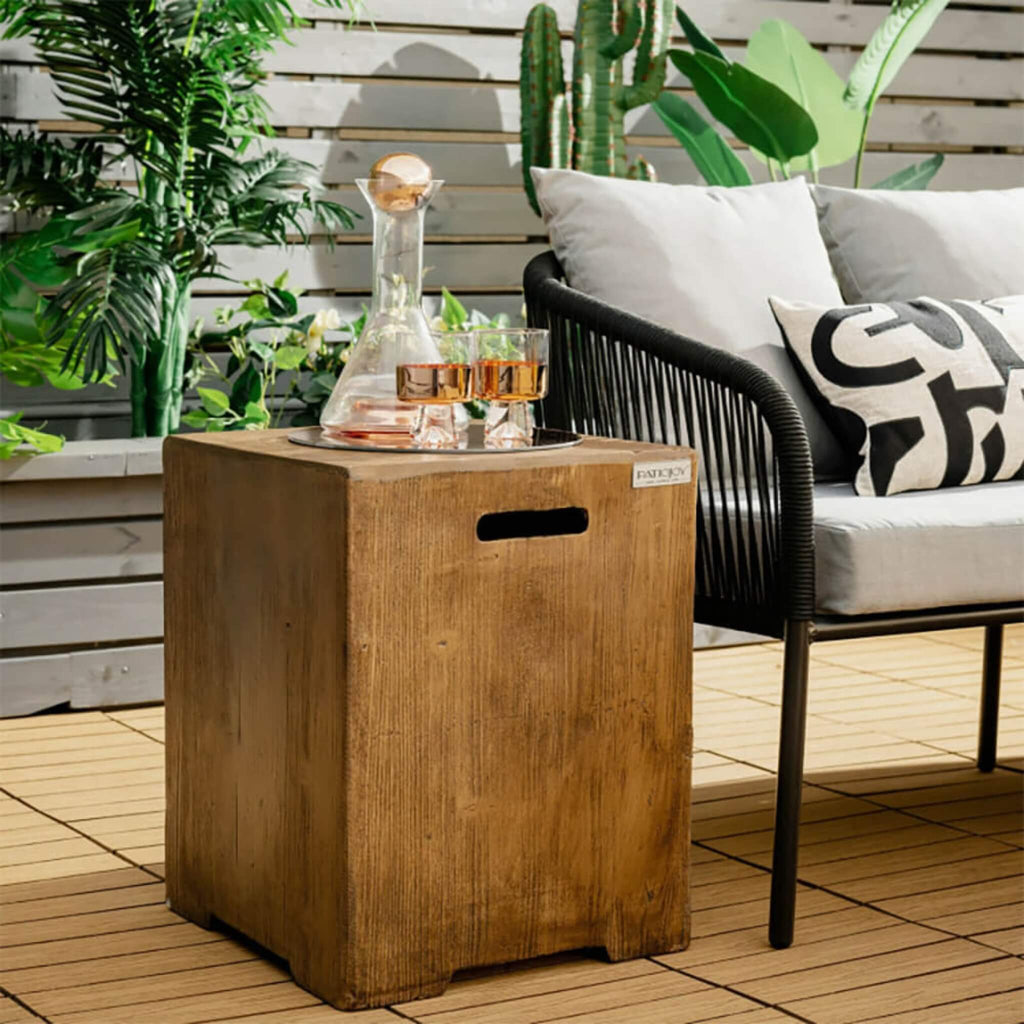 Premium 16-Inch Outdoor Hideaway Table Cover For Standard 20 LBS Propane Tank (SAK73142) - Saksby Wholesale - Lifestyle Image Beside Sofa Furniture