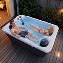 Premium 2-Person Outdoor Hot Tub With 15 Stainless Steel Jets (SAK92015) - Lifestyle With Man And Woman Inside