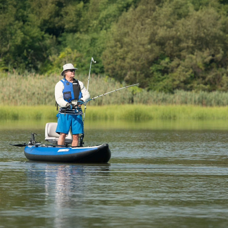 Man Fishing From A Kayak On A Calm Lake With Trees In The Background - Saksby Wholesale