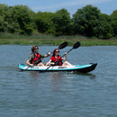 Two People Kayaking On A Calm Lake With Trees In The Background - Saksby Wholesale