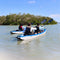 Two Kayaks With People Paddling On A Calm Body Of Water With Trees In The Background - Saksby Wholesale