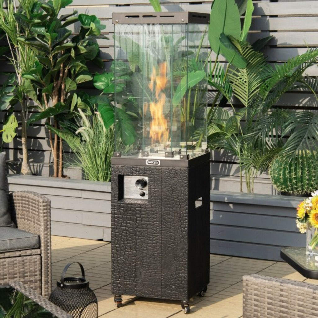 41K BTU Outdoor Propane Gas Patio Heater W/ Lockable Wheels (SAK98052) - Saksby Wholesale - Lifestyle Image In Patio With Flame