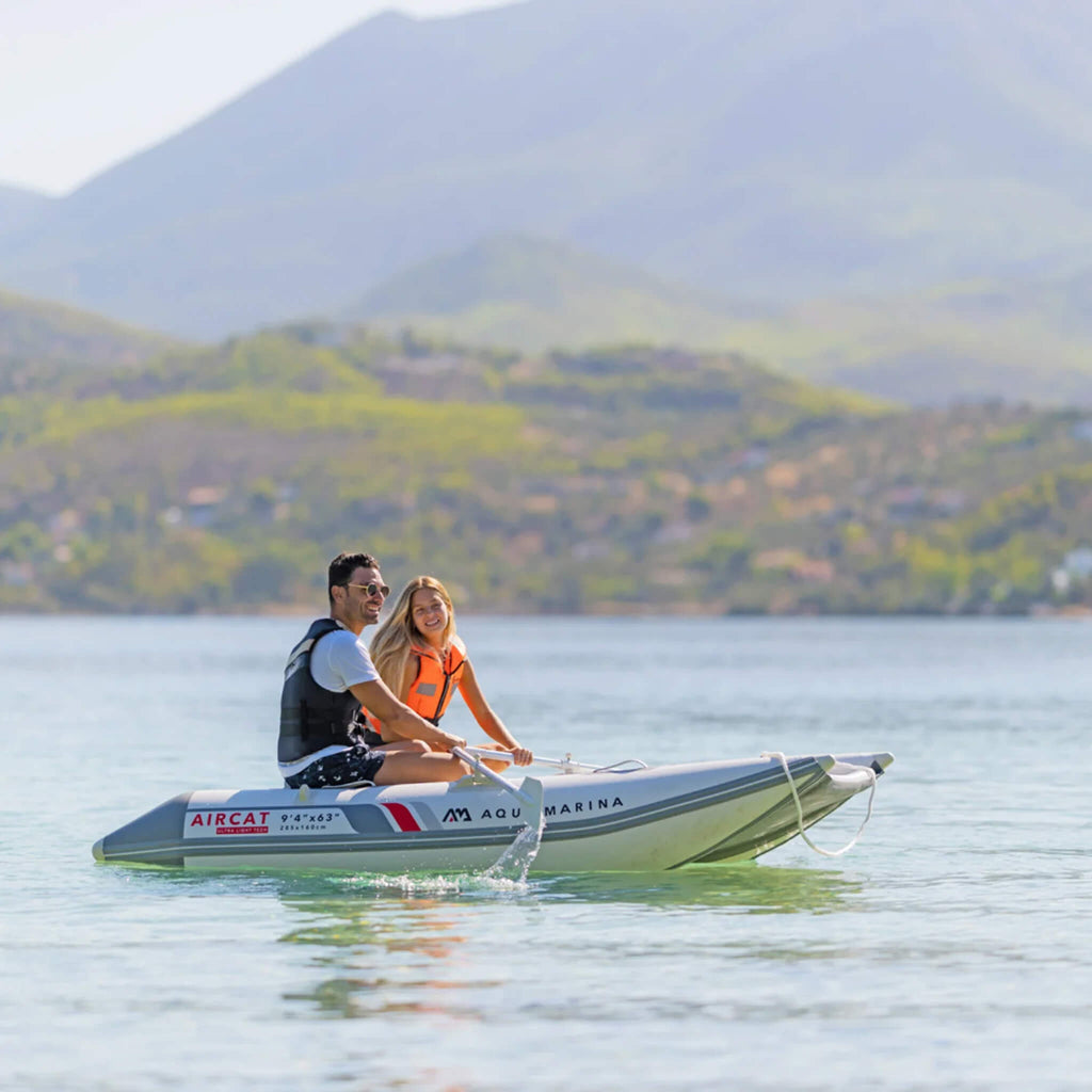 Aqua Marina Aircat 11FT 5-Person High-Speed Inflatable Catamaran With DWF Air Deck [BT-AC335] (SAK10650) - Saksby Wholesale - Man And Woman Onboard Lifestyle View