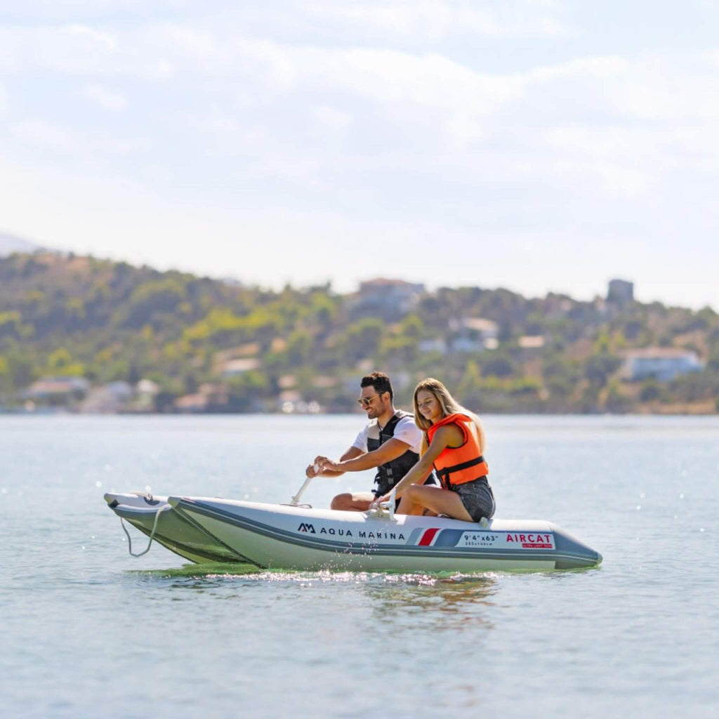 Aqua Marina Aircat 11FT 5-Person High-Speed Inflatable Catamaran With DWF Air Deck [BT-AC335] (SAK10650) - Saksby Wholesale - Man And Woman Paddling Towards Left View
