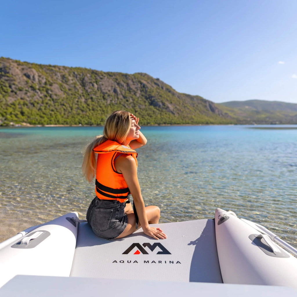 Aqua Marina Aircat 11FT 5-Person High-Speed Inflatable Catamaran With DWF Air Deck [BT-AC335] (SAK10650) - Saksby Wholesale - Woman Posing Onboard Lifestyle View