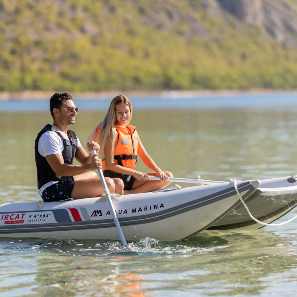 Aqua Marina Aircat 11FT 5-Person High-Speed Inflatable Catamaran With DWF Air Deck [BT-AC335] (SAK10650) - Saksby Wholesale - Zoom Man And Woman Paddling View