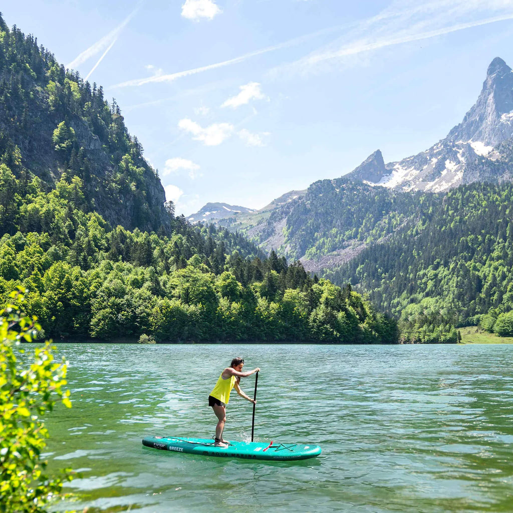 Aqua Marina Breeze 9FT Green Compact Inflatable SUP With Drop Stitch Light Technology [BT-23BRP] (SAK68745) - Saksby Wholesale - Woman On Lake With Mountain Background