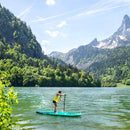 Aqua Marina Breeze 9FT Green Compact Inflatable SUP With Drop Stitch Light Technology [BT-23BRP] (SAK68745) - Saksby Wholesale - Woman On Lake With Mountain Background