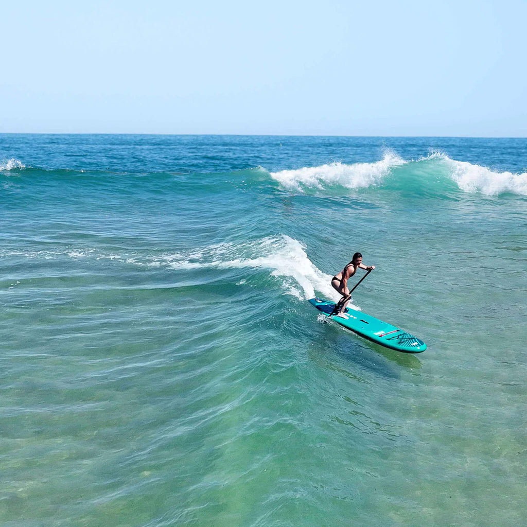 Aqua Marina Breeze 9FT Green Compact Inflatable SUP With Drop Stitch Light Technology [BT-23BRP] (SAK68745) - Saksby Wholesale - Woman Paddling On Open Sea