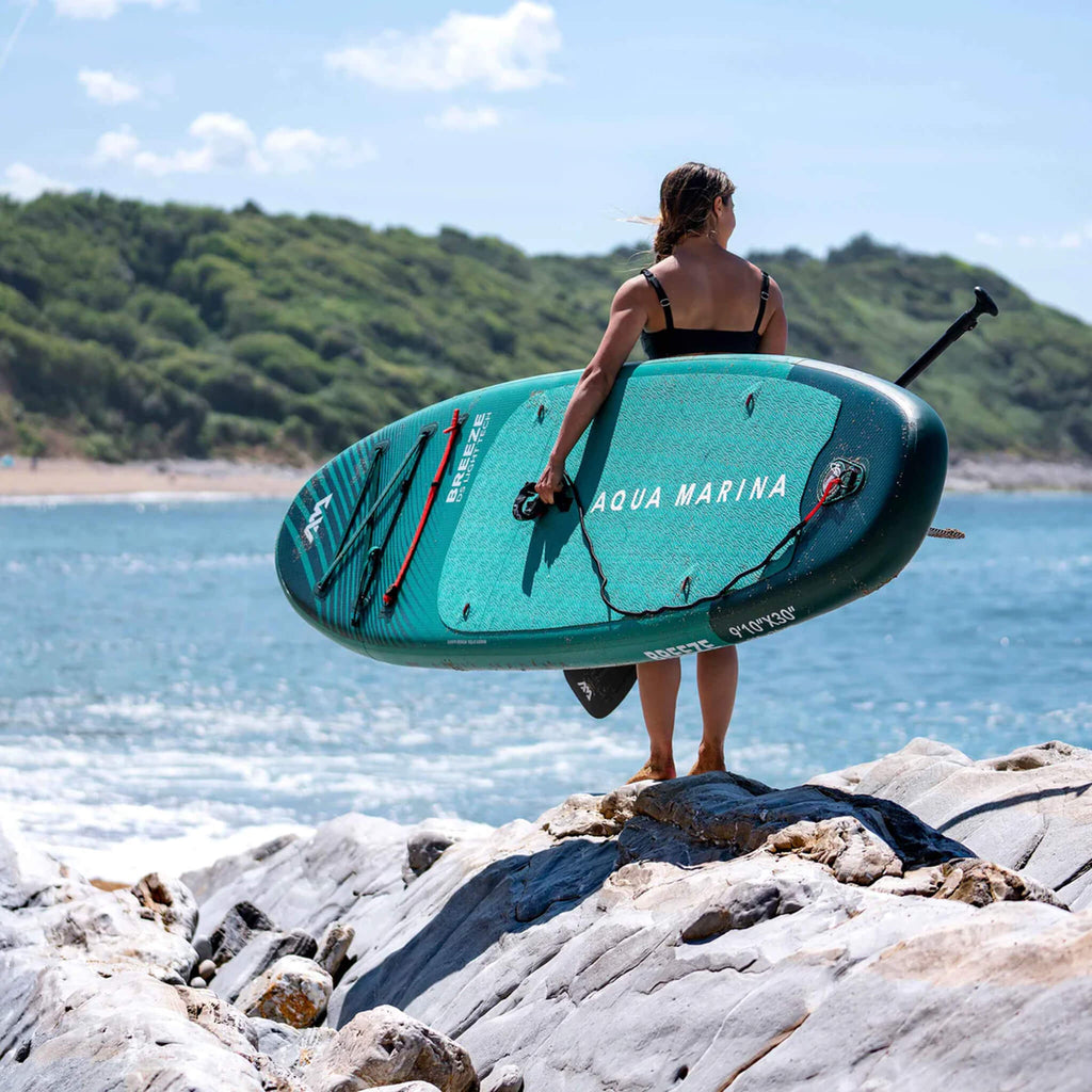 Aqua Marina Breeze 9FT Green Compact Inflatable SUP With Drop Stitch Light Technology [BT-23BRP] (SAK68745) - Saksby Wholesale -  Woman Standing On Shore Back View