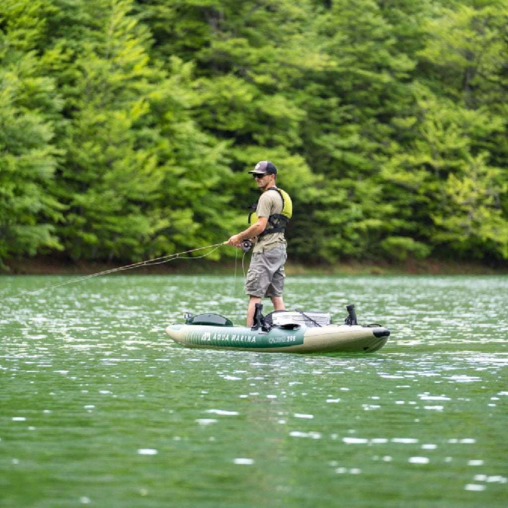 Aqua Marina Caliber 13FT Angling Kayak With Foldable Fishing Seat [Paddle Excluded] [CA-398] (SAK23467) - Saksby Wholesale - Lifestyle Image of Man Standing While Fishing In The Kayak