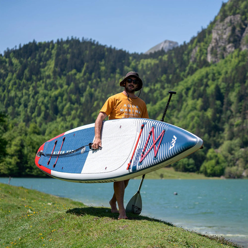 Aqua Marina Hyper 12FT Navy Touring SUP With Hydrodynamic Rail Edges & Adjustable Bungee [BT-23HY02] (SAK23285) - Saksby Wholesale - Lifestyle With Man Carrying