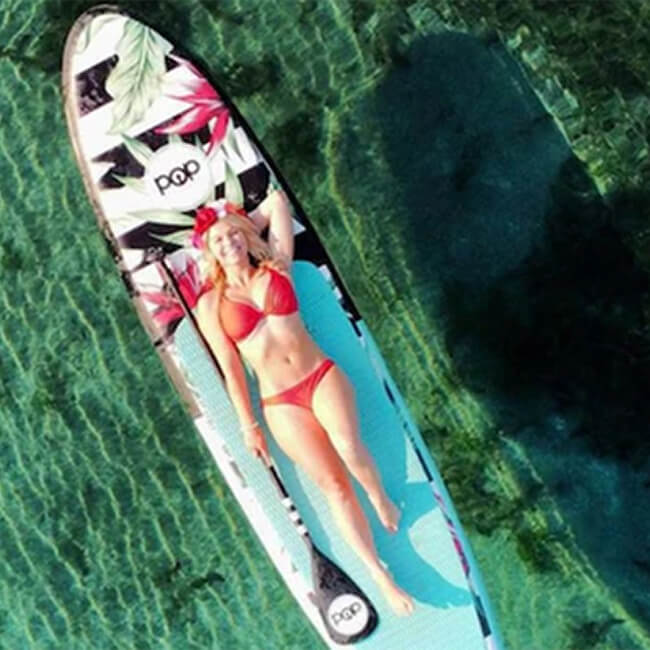Pop Board Co. Inflatable Board 10'6 Royal Hawaiian Mint/Black (SAK48622) - Saksby Wholesale - LIfestyle Image In Top View With Person