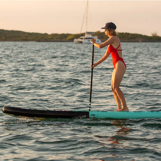 Pop Board Co. Inflatable Board 10'6 Royal Hawaiian Mint/Black (SAK48622) - Saksby Wholesale - Lifestyle Image With Women Standing While Paddling