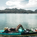 Pop Board Co. Inflatable Board 10'6 Royal Hawaiian Mint/Black (SAK48622) - Saksby Wholesale - Lifestyle Image With Women Lying Her Back On Top