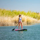 Pop Board Co. Inflatable Board 10'6 Royal Hawaiian Pink/Black (SAK36410) - Saksby Wholesale - Lifestyle Image While Paddling In The Sea