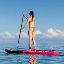 Pop Board Co. Inflatable Board 10'6 Royal Hawaiian Pink/Black (SAK36410) - Saksby Wholesale - Lifestyle Image While Standing In The Board